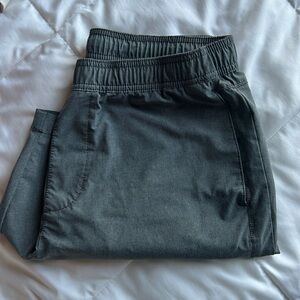 Dark grey Hollister 7” shorts with adjustable drawstrings and lining on inside.